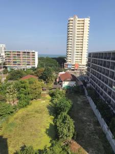 a park in the middle of a city with buildings at Lacasita484 In Huahin in Hua Hin