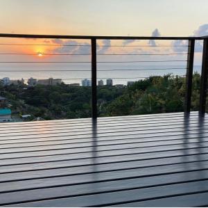 a view of the sunset from a balcony at Billfish Apartments in Ballito
