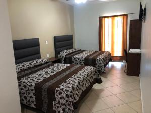 Postel nebo postele na pokoji v ubytování Hotel Posada Ruiseñor