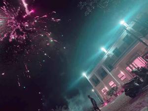 a firework display in front of a building at night at 枋山六號 in Shizi