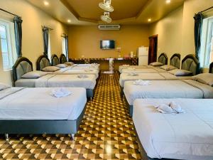 Postel nebo postele na pokoji v ubytování Benwadee Resort Pattaya
