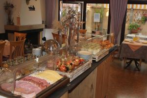 a buffet line with many different types of food at Hotel garni Fuchs in Eichstätt