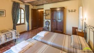 Postel nebo postele na pokoji v ubytování Colle Cavalieri - Country House