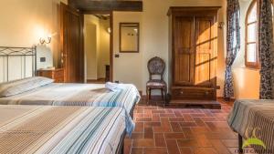 Postel nebo postele na pokoji v ubytování Colle Cavalieri - Country House