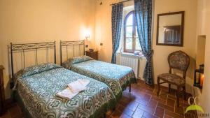 Postel nebo postele na pokoji v ubytování Colle Cavalieri - Country House
