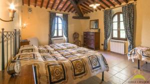 Postel nebo postele na pokoji v ubytování Colle Cavalieri - Country House