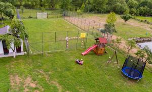 an aerial view of a park with a playground at Pensiunea Casa Maria in Corbeni
