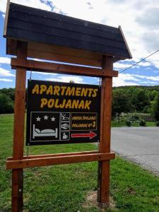 a sign for a parkpoundsounds poundmark at Apartments Poljanak in Poljanak