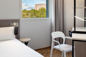 Postel nebo postele na pokoji v ubytování B&B HOTEL Madrid Alcorcón
