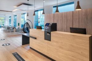 an office lobby with a reception counter with a desk at B&B HOTEL Madrid Alcorcón in Alcorcón