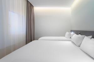 Postel nebo postele na pokoji v ubytování B&B HOTEL Madrid Alcorcón