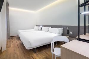 Postel nebo postele na pokoji v ubytování B&B HOTEL Madrid Alcorcón