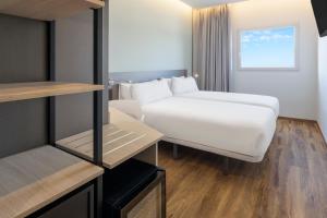 Postel nebo postele na pokoji v ubytování B&B HOTEL Madrid Alcorcón