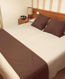 Letto o letti in una camera di Hotel Castel Miramonti