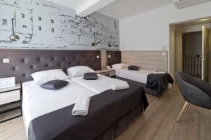 Кровать или кровати в номере Hotel Perla