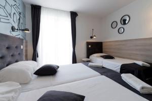 Кровать или кровати в номере Hotel Perla