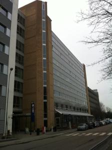 a large building on a street with cars parked in front at Ullev&aring;l Hotel in Oslo