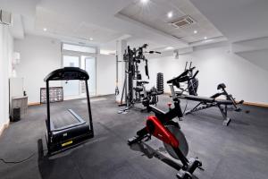 a gym with several exercise bikes in a room at Hotel Perla in Dubrovnik