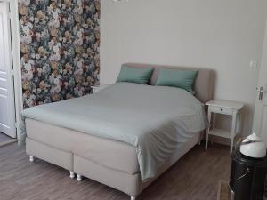 Postel nebo postele na pokoji v ubytování La P'tite Place