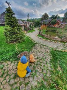 two teddy bears sitting on a rock path at Valea celor Doisprezece in Pîrîu Dobreni