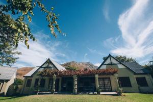 a house with a mountain in the background at ATKV Goudini Spa in Rawsonville