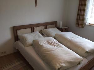 A bed or beds in a room at Haus Eiter