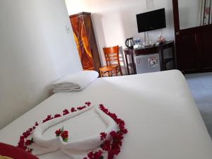 Postel nebo postele na pokoji v ubytování Minh Ngoc Hotel