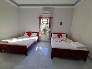 Postel nebo postele na pokoji v ubytování Minh Ngoc Hotel