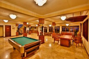 a large room with a pool table in it at The Jayakarta Cisarua in Puncak