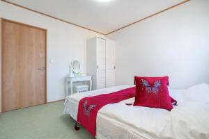 Postel nebo postele na pokoji v ubytování Travel Palace Miyuki