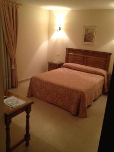 Postel nebo postele na pokoji v ubytování Hotel Las Fuentes