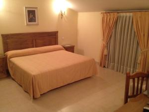 Postel nebo postele na pokoji v ubytování Hotel Las Fuentes