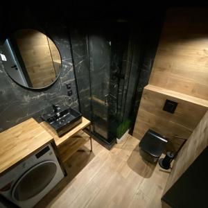 an overhead view of a bathroom with a sink and a mirror at Countryside Retreat in Janowice Wielkie