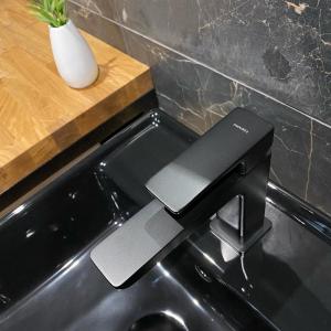 a kitchen sink with a black stove top oven at Countryside Retreat in Janowice Wielkie +10 photos