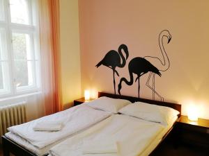 Posteľ alebo postele v izbe v ubytovaní Flamingo Apartments