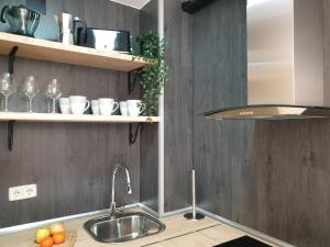Kuchyň nebo kuchyňský kout v ubytování Apartamento El sarrio + 37 fotografií