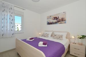 Posteľ alebo postele v izbe v ubytovaní Apartman "Mary"
