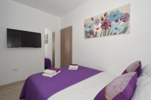 Posteľ alebo postele v izbe v ubytovaní Apartman "Mary"
