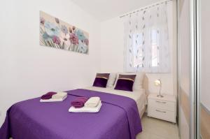 Posteľ alebo postele v izbe v ubytovaní Apartman "Mary"