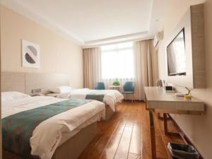 Voodi või voodid majutusasutuse Shell Huaibei City Xiangshan District Cuifeng Road Hotel toas