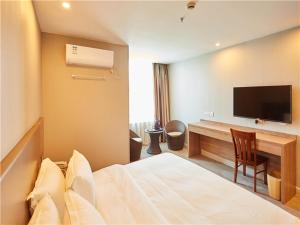 Postel nebo postele na pokoji v ubytování Shell Wuhu City Jinghu District Rehabilitation Road Hotel