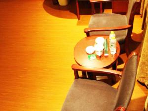 a table and chairs with candles on top of it at GreenTree Inn Shandong Qingdao Development District SDUST Express Hotel in Huangdao +48 photos
