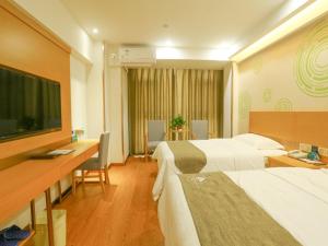 Ένα ή περισσότερα κρεβάτια σε δωμάτιο στο GreenTree Inn Shangqiu Liangyuan District Suiyang Avenue Hotel
