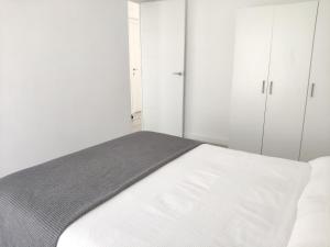 Posteľ alebo postele v izbe v ubytovaní Atico Condal