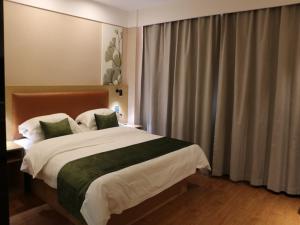Ένα ή περισσότερα κρεβάτια σε δωμάτιο στο GreenTree Inn Hengshui Jingtai Avenue +9 φωτογραφίες