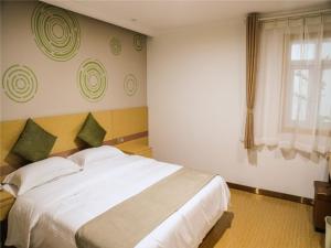Ένα ή περισσότερα κρεβάτια σε δωμάτιο στο GreenTree Inn Nanjing Zhongshan Mausoleum Scenic Area Zhongling Street Subway Station Express Hotel +15 φωτογραφίες