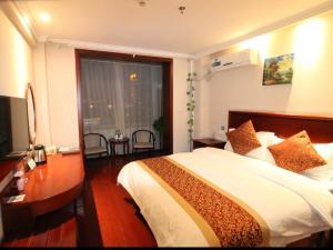 Ένα ή περισσότερα κρεβάτια σε δωμάτιο στο GreenTree Inn ShanXi ChangZhi Bus Passenger Station XiHuan Road Business Hotel