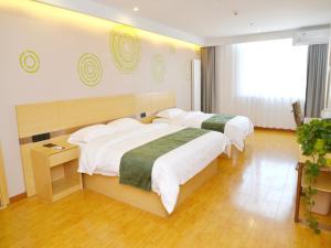 Ένα ή περισσότερα κρεβάτια σε δωμάτιο στο GreenTree Inn Beijing Yanqing District Badaling Changcheng Kangzhuang Smart Choice Hotel +24 φωτογραφίες
