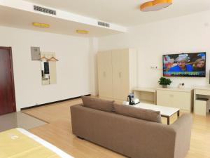 TV a/nebo společenská místnost v ubytování Shell Langfang Bazhou Museum Yingbin Dongdao Hotel + 19 fotografií