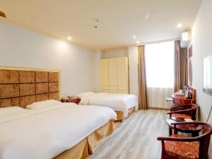 En eller flere senge i et værelse på GreenTree Inn AnHui HeFei BinHu New District FangXin Avenue Sichuan Road Express Hotel